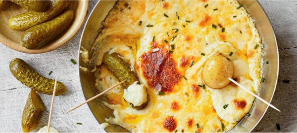 Baked fondue with potato and pickle dippers