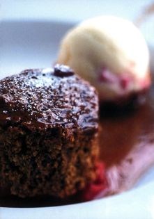 Baked ginger parkin with rhubarb ripple ice cream, hot spiced treacle