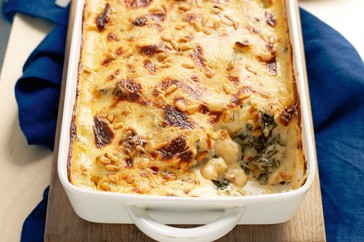Baked gnocchi spanakopita with currants and pine nuts
