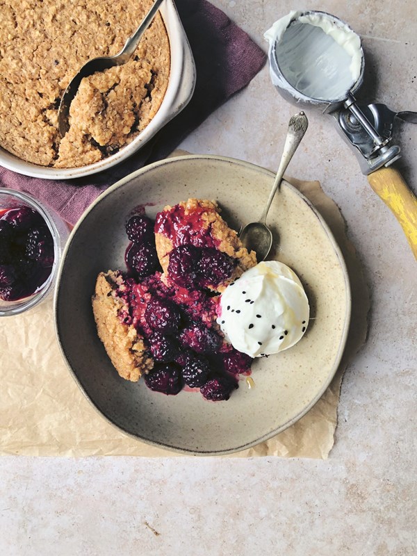 Baked grain bowl with blackberries and maple