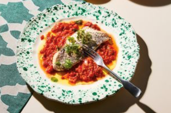 Baked Greek fish with tomatoes and potato wedges
