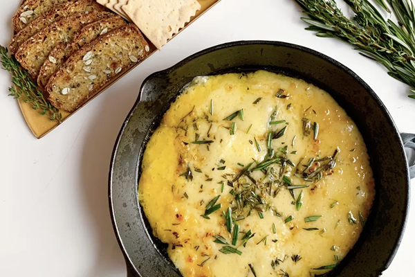 Baked Gruyère with garlic & herbs