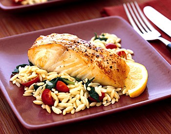 Baked halibut with orzo, spinach, and cherry tomatoes