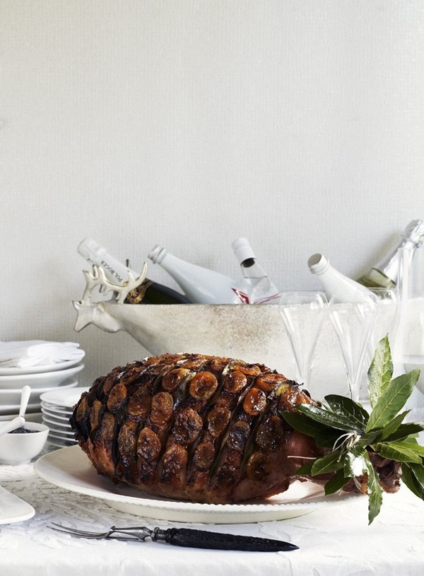 Baked ham with glazed apricots and bay leaves