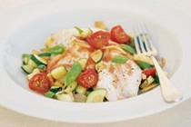 Baked hapuku with fennel, cherry tomatoes and courgettes