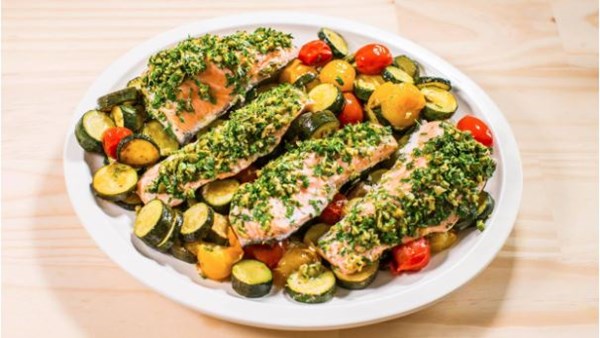 Baked herb-crusted salmon with zucchini and cherry tomatoes