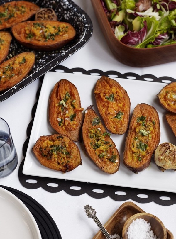 Baked kumara with roasted garlic butter
