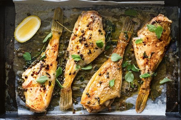 Baked leatherjackets with marjoram and capers