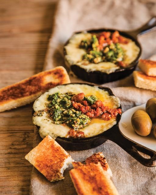 Baked Manchego with chorizo and salsa verde