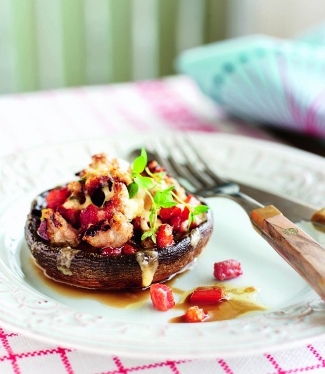 Baked mushrooms with sausage, bacon and tomatoes