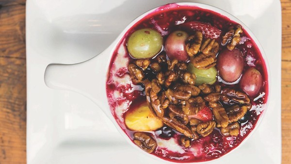 Baked oatmeal with raspberry compote and candied pecans