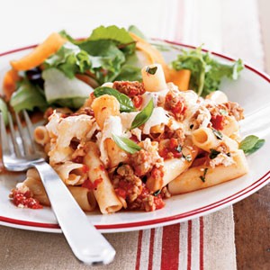 Baked pasta with sausage, tomatoes, and cheese