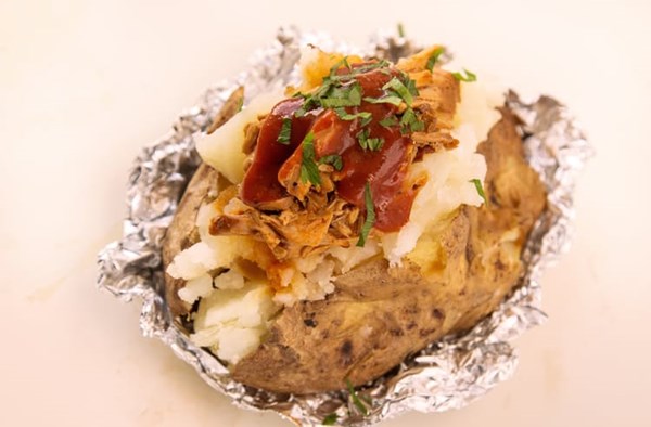 Baked potato stuffed with barbecue pulled pork