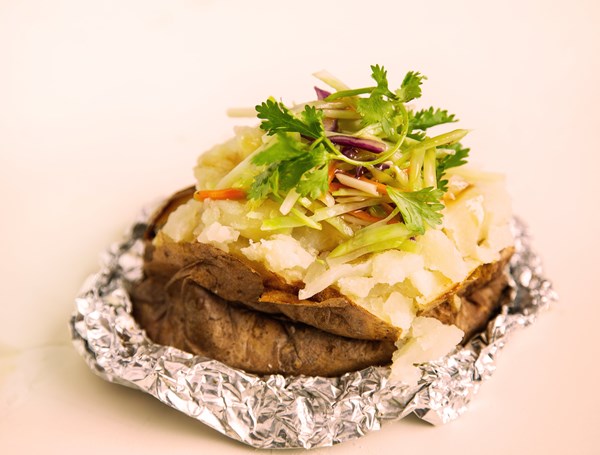 Baked potato stuffed with stir-fried sesame slaw