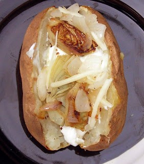 Baked potato with onions and artichoke hearts