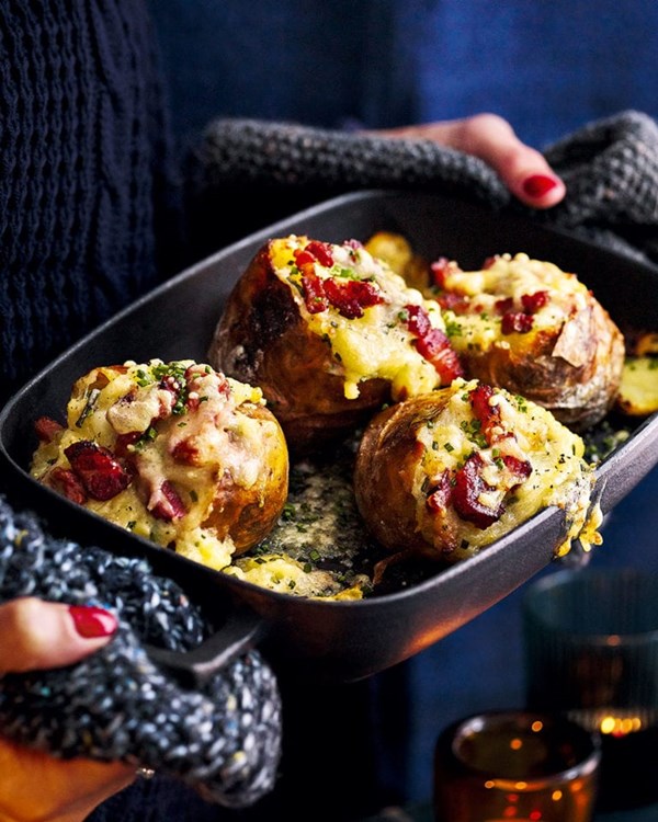 Baked potatoes stuffed with bacon, cheese and chives 
