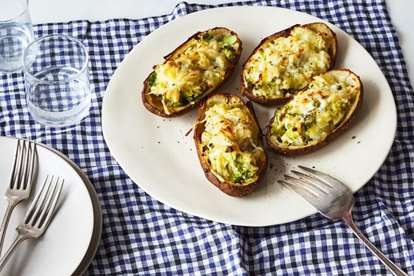 Baked potatoes stuffed with broccoli and cheddar cheese