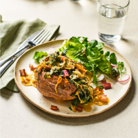 Baked potatoes with caramelised onions, Gorgonzola and chard