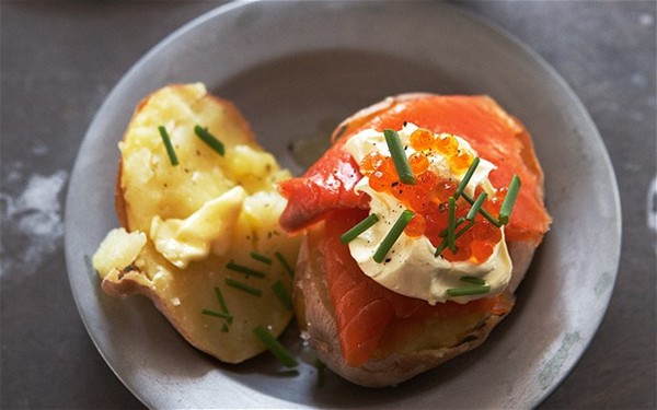Baked potatoes with smoked trout, sour cream and chives