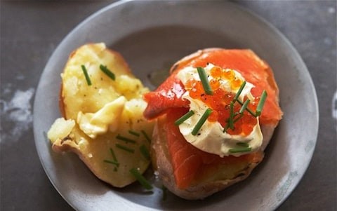 Baked potatoes with smoked trout, sour cream and chives