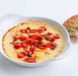 Baked provolone with tomatoes, marjoram, and balsamic