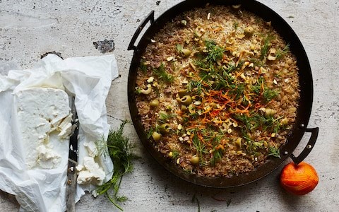 Baked rice with green olives, orange, feta and dill