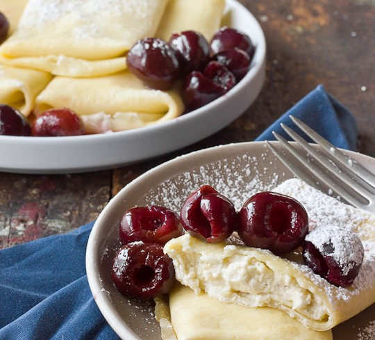 Baked ricotta blintzes with fresh cherry sauce