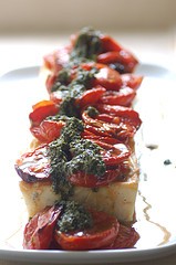 Baked ricotta with roasted tomatoes & basil oil