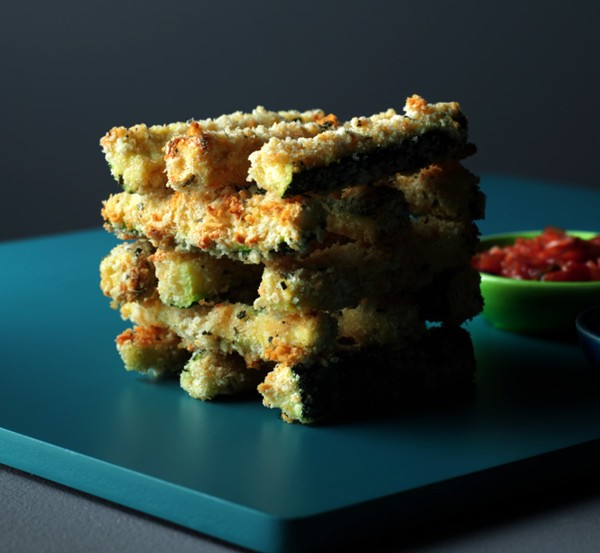 Baked rosemary courgette fritters served with marinara sauce dip and roasted garlic skinny dip