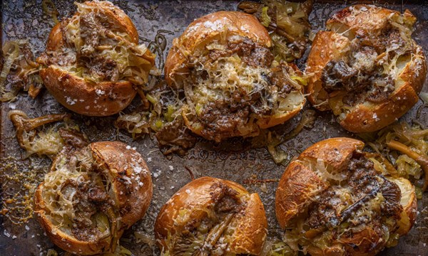 Baked russet potato with melted leeks, chanterelles and black truffle butter