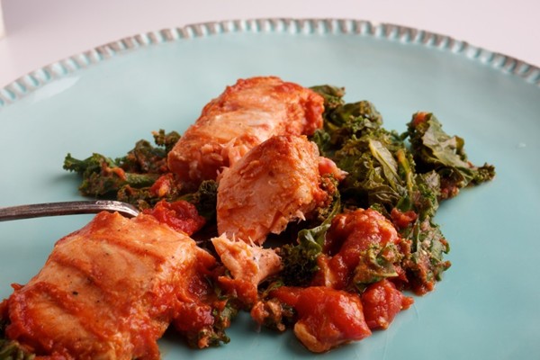 Baked salmon and kale in Moroccan-spiced tomato sauce