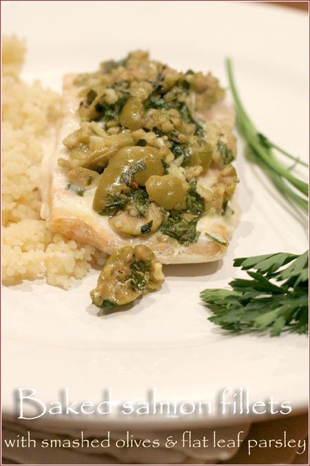 Baked salmon fillets with smashed olives, flat leaf parsley and garlic