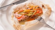 Baked salmon in parchment with julienned vegetables