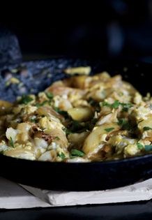Baked salt cod with peppers and potatoes (Bacalhau com batatas)