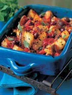 Baked salt cod with potatoes, tomatoes and basil