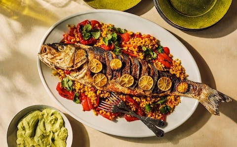 Baked sea bass with coriander, chilli and tomato stuffing
