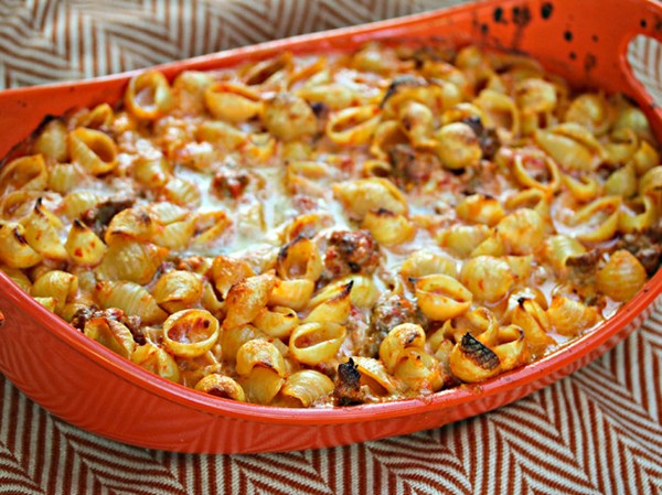 Baked shells with roasted red pepper cream sauce and Italian sausage