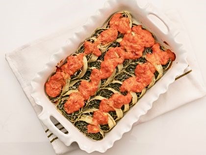Baked sliced pasta roll filled with spinach (Rotolo di pasta)
