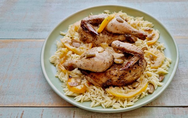 Baked spatchcock with lemon, garlic & olives