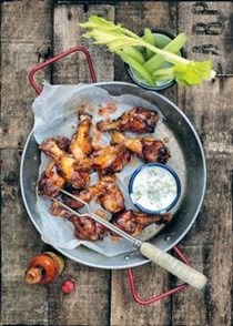 Baked sticky Buffalo chicken wings with celery sticks & blue cheese dip