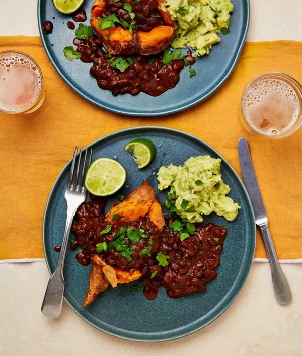 Baked sweet potatoes with chipotle beans