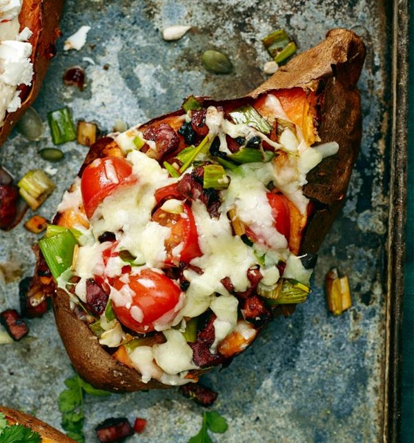 Baked sweet potatoes with chorizo and melting cheese