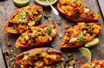 Baked sweet potatoes with feta, black beans & coriander
