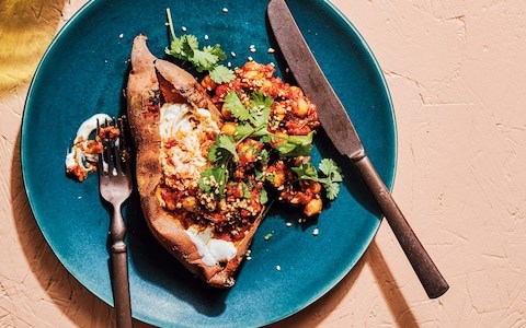 Baked sweet potatoes with harissa chickpeas and tahini sauce