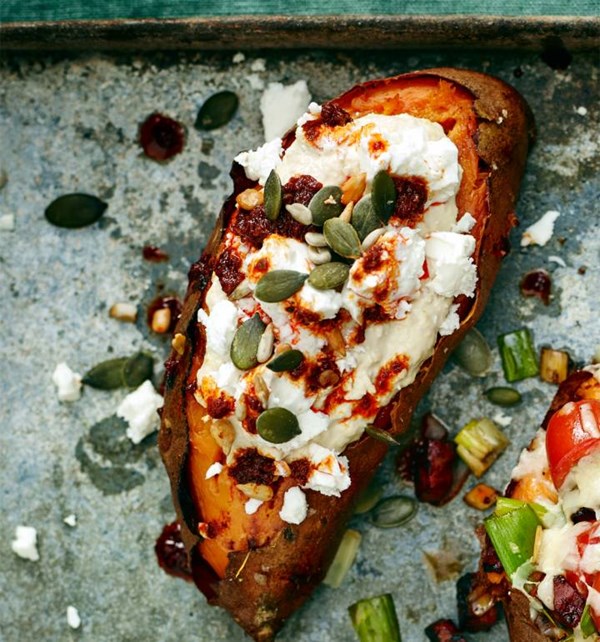 Baked sweet potatoes with houmous and harissa