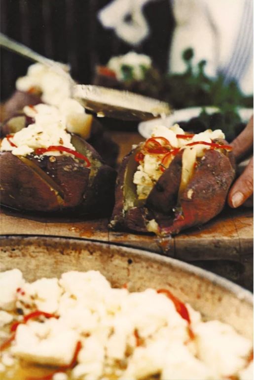 Baked sweet potatoes with marinated feta and black olives