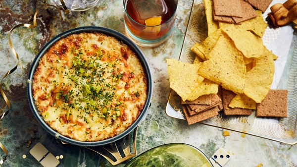 Baked three-cheese onion dip with chive and peperoncini