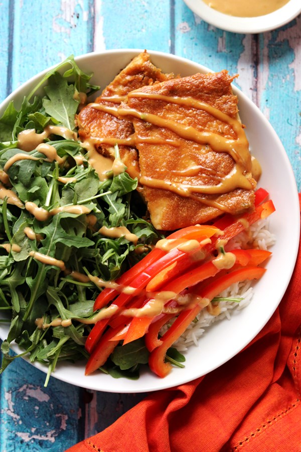Baked tofu with peanut sauce, pickled peppers, and coconut lime rice