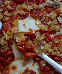 Baked tomatoes, anchovies, garlic and breadcrumbs