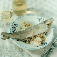 Baked trout stuffed with rice, hazelnuts and rosemary